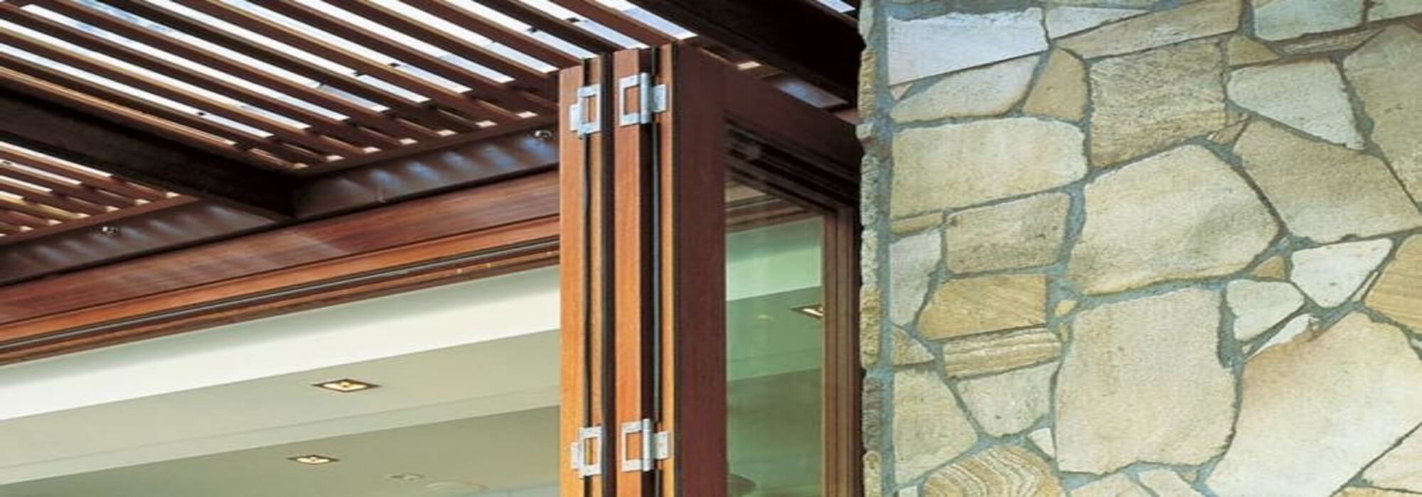 Centor bi-fold door hinges connecting wooden door panels.